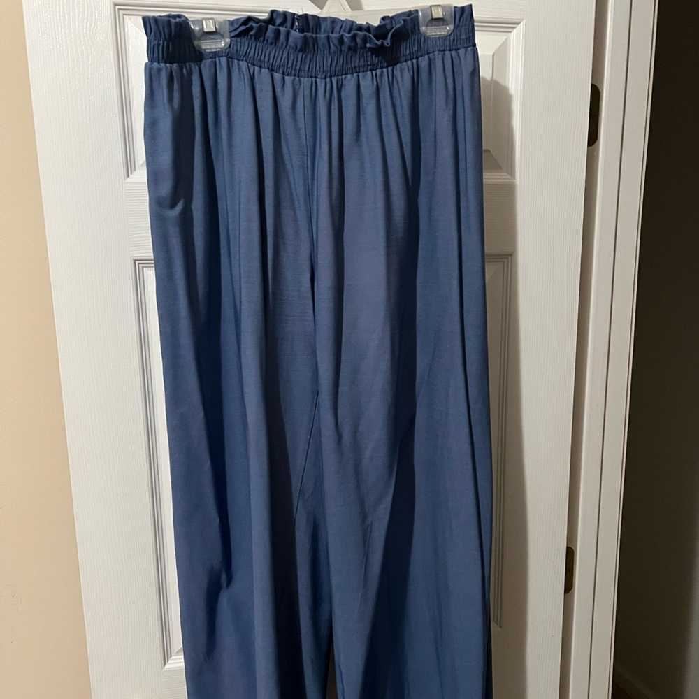 Jean-like. Very cute and flattering. Photo doesn’t do justice. NOT stretchy